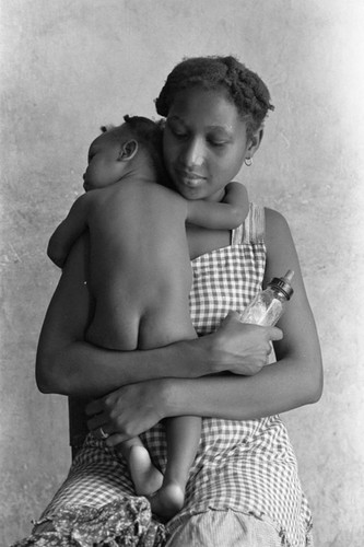 Woman holding a baby, San Basilio de Palenque, 1976