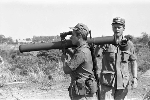 A U.S. military advisor training a Salvadoran soldier at Ilopango Military Base, Ilopango, 1983