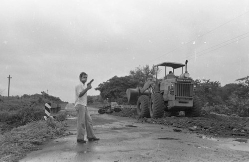 Sandinista stands near a bridge, Nicaragua, 1979