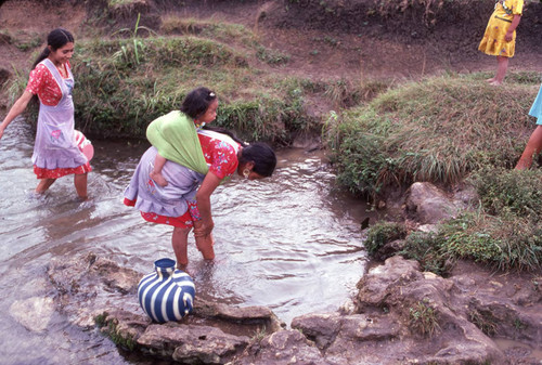 Guatemalan refugees at a river, Cuauhtémoc, 1983