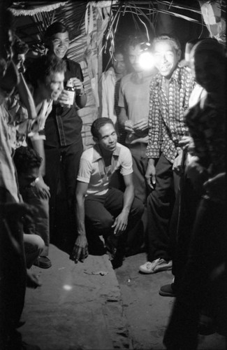 Men celebrating in the evening, Barranquilla, Colombia, 1977