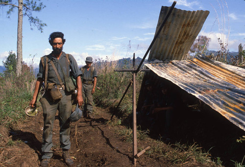 Two Contra soldiers pose next to a makeshift tent, Nicaragua, 1983 ...