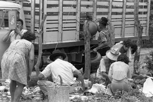 Wrapping clay pieces, La Chamba, Colombia, 1975