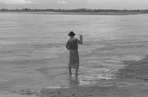 Fisherman holding a net, La Chamba, Colombia, 1975