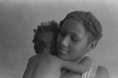 Woman holding a baby, San Basilio de Palenque, 1976