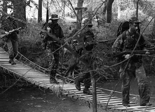 Survival school students cross a bridge, Liberal, 1982