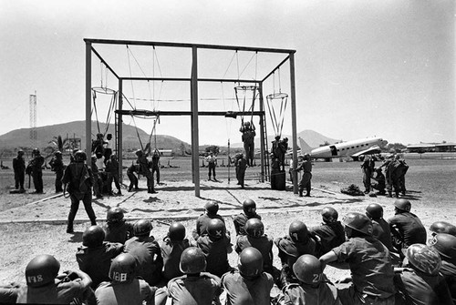 Salvadoran soldiers receiving parachute training at military base, Ilopengo, 1983