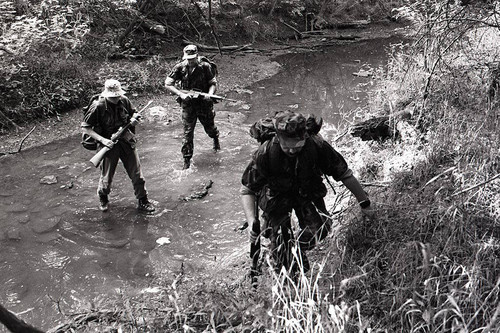 Survival school students participate in an obstacle course training, Liberal, 1982