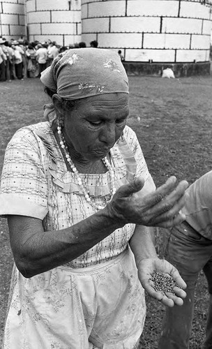 Woman sifts grain, Nicaragua, 1980