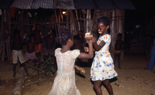 Girls boxing outdoors, San Basilio de Palenque, 1976