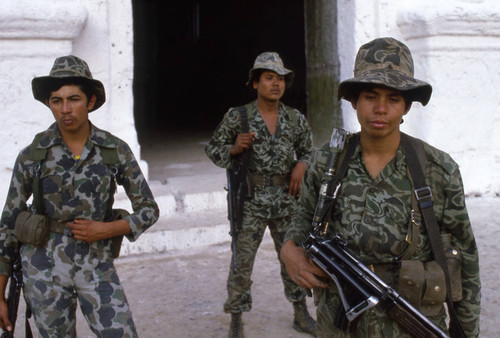 Three soldiers in front of church, Chajul, 1982