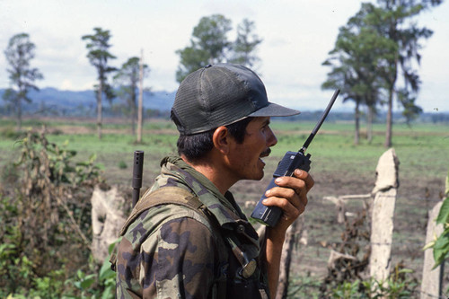 Contra soldier makes a radio call, Nicaragua, 1983