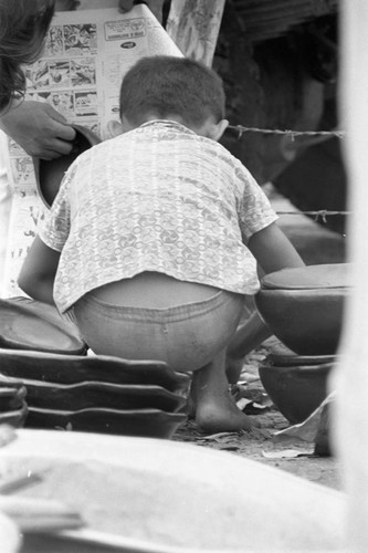 Wrapping clay pieces, La Chamba, Colombia, 1975