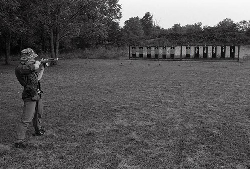 Survival school student shoots targets, Liberal, 1982