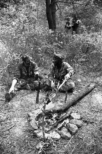 Survival school students roast a rabbit, Liberal, 1982