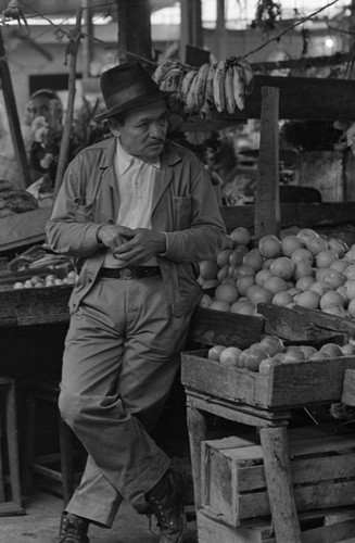 A man at the market, Tunjuelito, Colombia, 1977