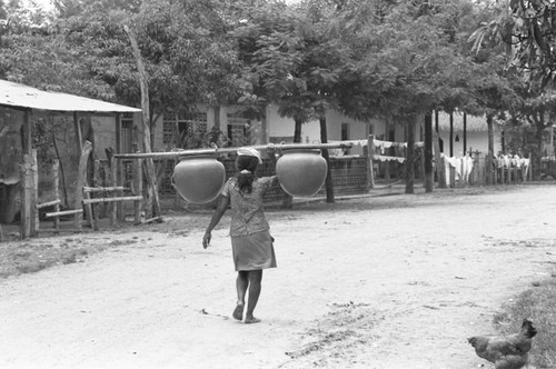 Transporting clay goods, La Chamba, Colombia, 1975