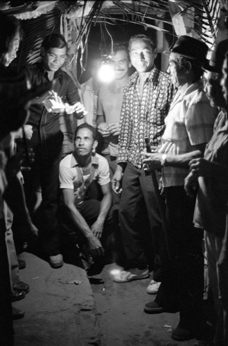 Men celebrating in the evening, Barranquilla, Colombia, 1977