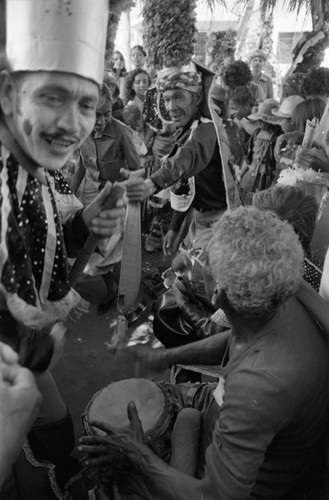 Dancers dancing among the Carnival crowd, Barranquilla, Colombia, 1977