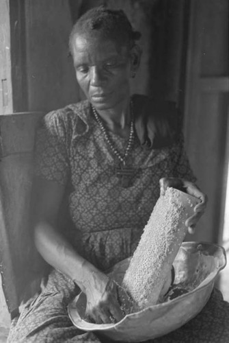 Woman grating coconut, San Basilio de Palenque, 1975