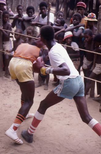 Boxers fighting inside boxing ring, San Basilio de Palenque, 1976