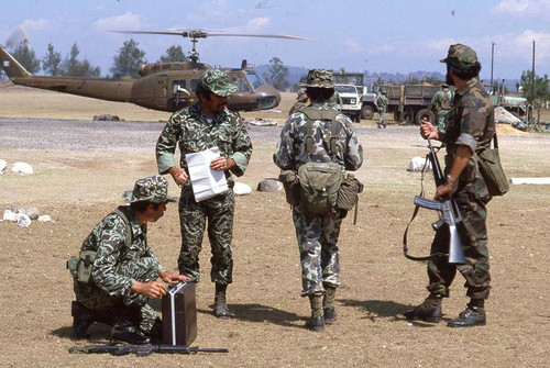 Three soldiers and an officer, Santa Cruz del Quiché, 1982