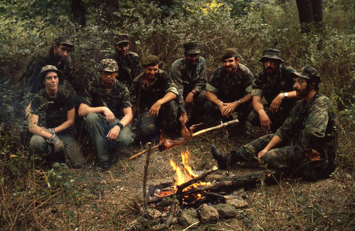 Survival school students at a campfire, Liberal, 1982