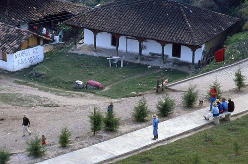 Aerial view of Mayan men sitting on a bench, Chajul, 1982