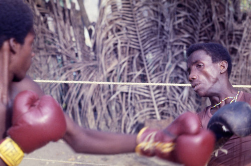 Men boxing in boxing ring, San Basilio de Palenque, 1976