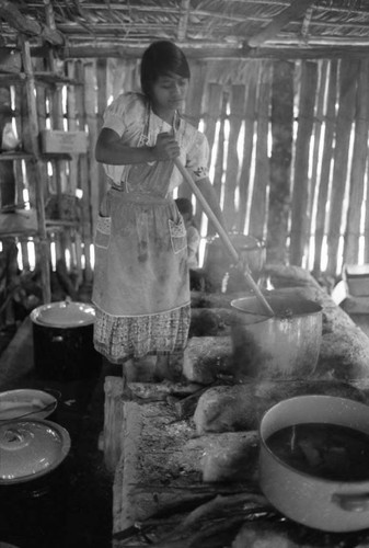 Refugee woman and cooking utensils, Chiapas, 1983