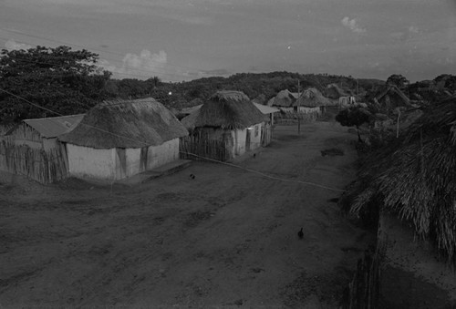 Electric poles standing in the street, San Basilio de Palenque, 1976