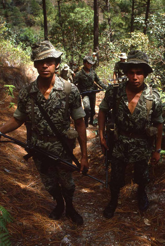 Armed soldiers on patrol, Guatemala, 1982