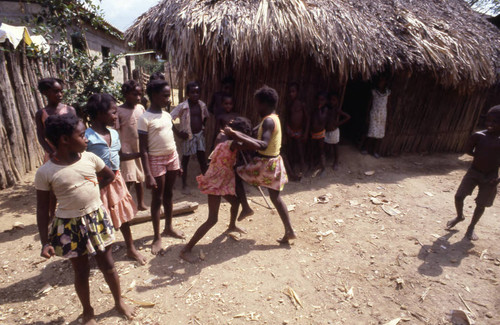 Girls boxing outdoors, San Basilio de Palenque, 1976