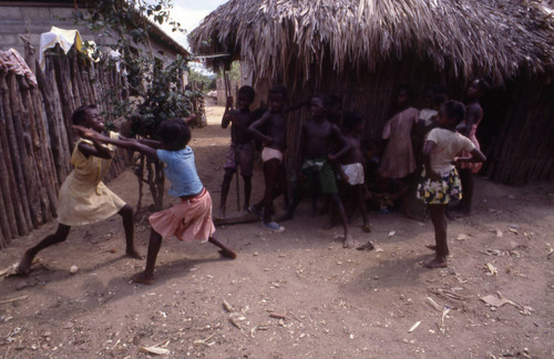 Girls boxing outdoors, San Basilio de Palenque, 1976