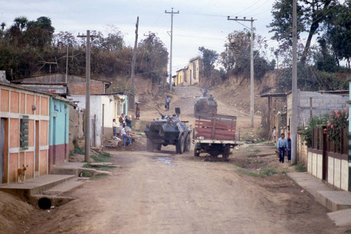 Two Cadillac Gage Commando vehicles patrol a hamlet, Zaragoza, 1982