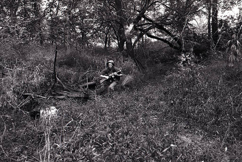 Survival school student holds a rifle, Liberal, 1982