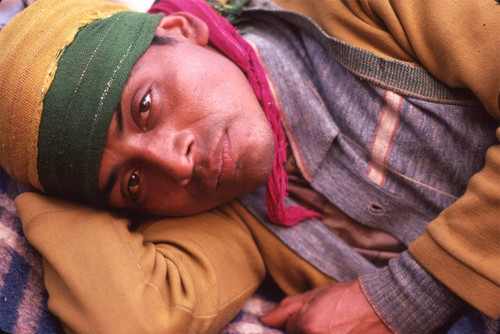 Guatemalan refugee laying on the ground, Santiago el Vértice, 1983