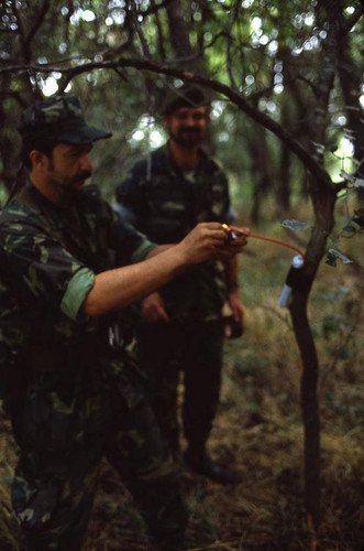 Survival school student learns about explosives, Liberal, 1982