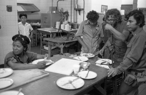 Sandinistas eat at a hotel, Managua, 1979