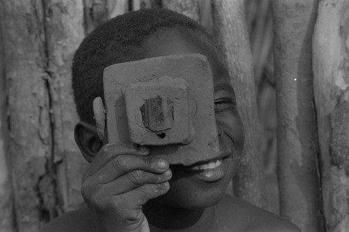 Boy playing with a toy camera, San Basilio de Palenque, 1977