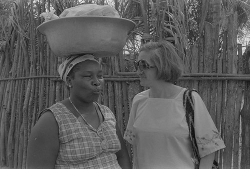 Nina S. de Friedemann and woman talking in the street, San Basilio de Palenque, ca. 1978