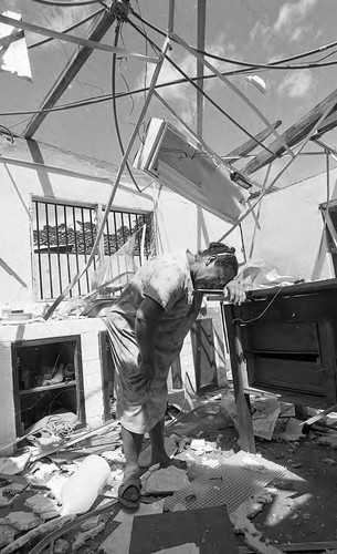 Woman cries in a destroyed building, Nicaragua, 1979