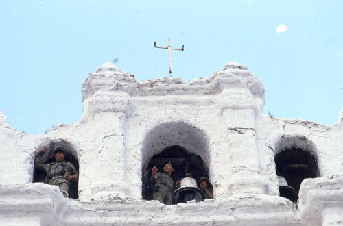 Soldiers on guard in a church belfry, Chajul, 1983