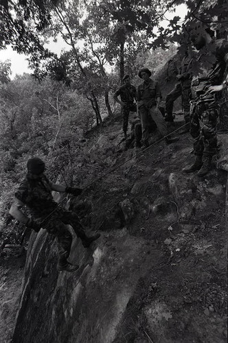 Claflin demonstrates rappelling, Liberal, 1982