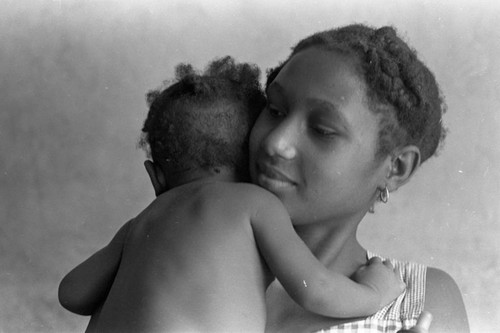 Woman holding a baby, San Basilio de Palenque, 1976