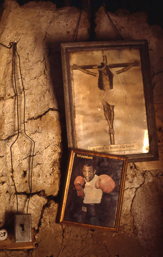 Pictures hanging from a wall, San Basilio de Palenque, 1976