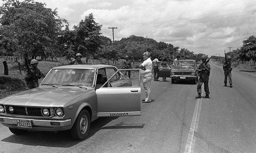 Armed men checking cars, Nicaragua, 1979