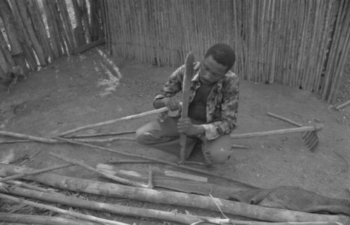 Man smoothing wood, San Basilio de Palenque, 1977