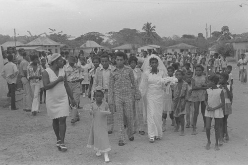 Wedding couple walking in the street, San Basilio de Palenque, 1976