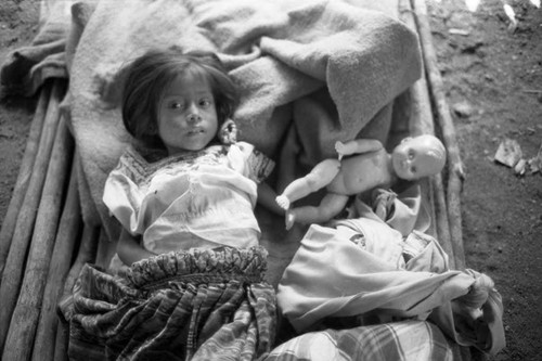 Refugee girl on a makshift cot, Chiapas, 1983